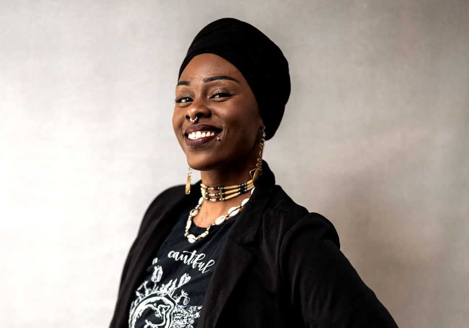 Hands of Oshun founder, radiating warmth and confidence